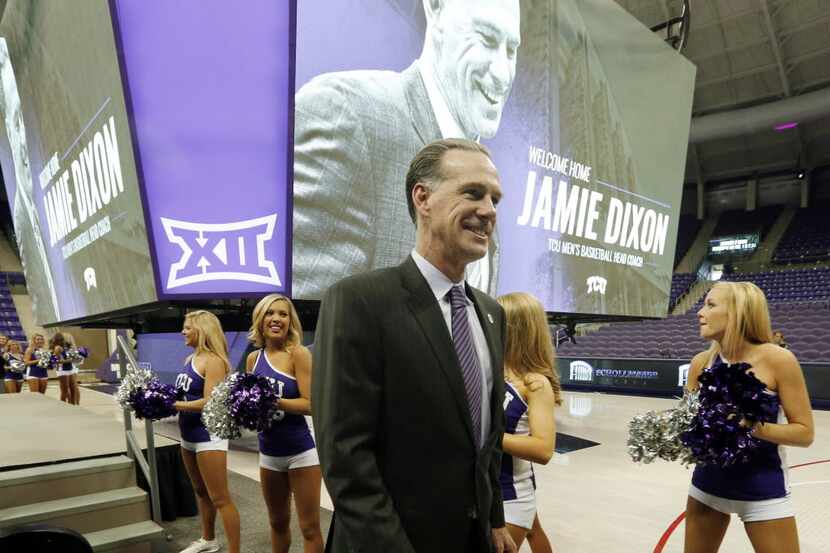 TCU's new men's basketball coach Jamie Dixon leaves the stafe after he was was introduced...