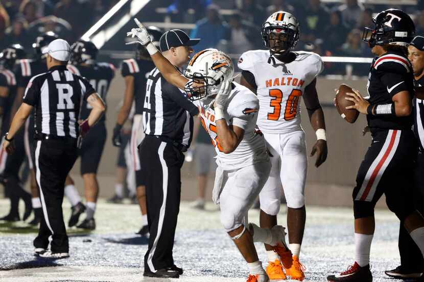 Haltom's Johnny Smith-Rider reacts after recovering a fumble for a touchback during Friday's...