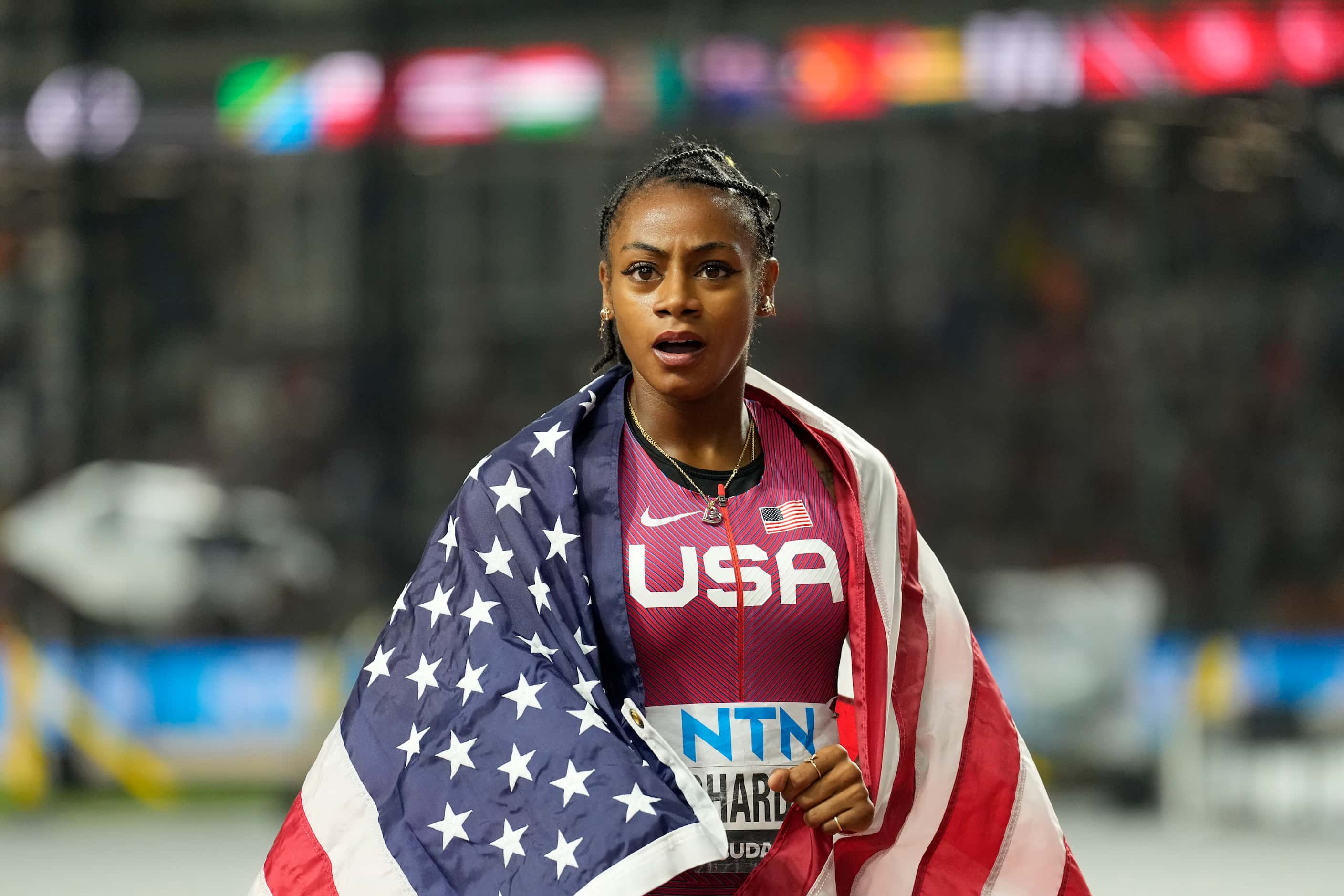 Sha'Carri Richardson, of the United States, celebrates winning the women's 100 meters during...