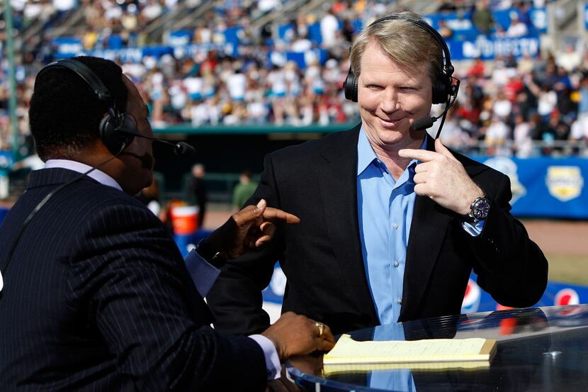 Announcers James Brown and Phil Simms (right).