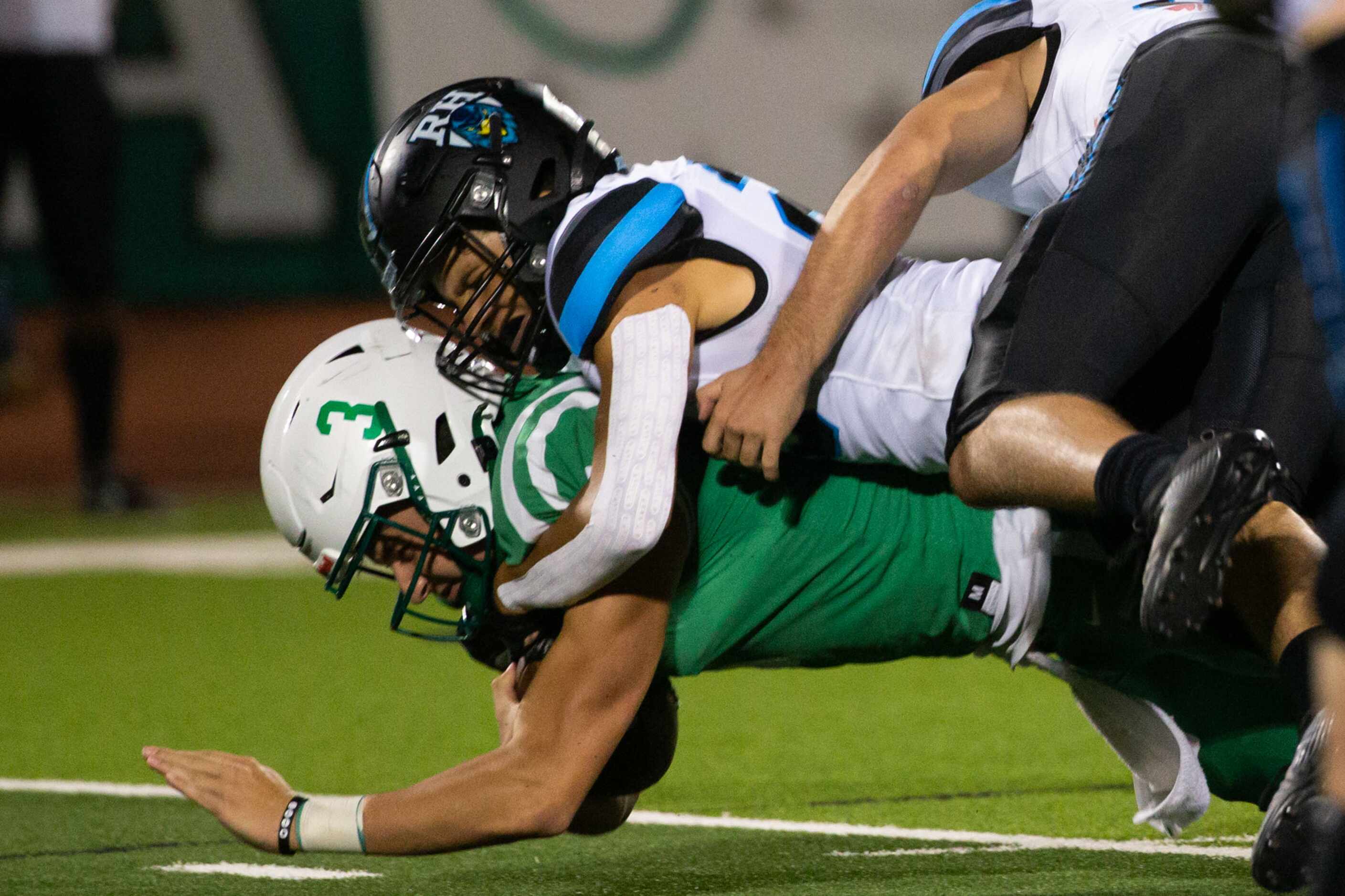 Lake Dallas quarterback Brendan Sorsby (3) is brought down by Rock Hill on a punt return...