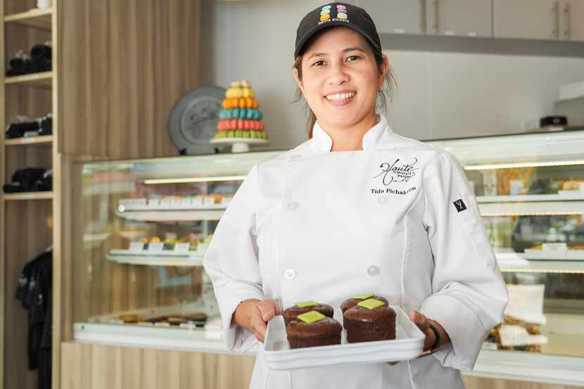 Chef Tida Pichakron with a tray of molten chocolate cake at Haute Sweets Patisserie in...