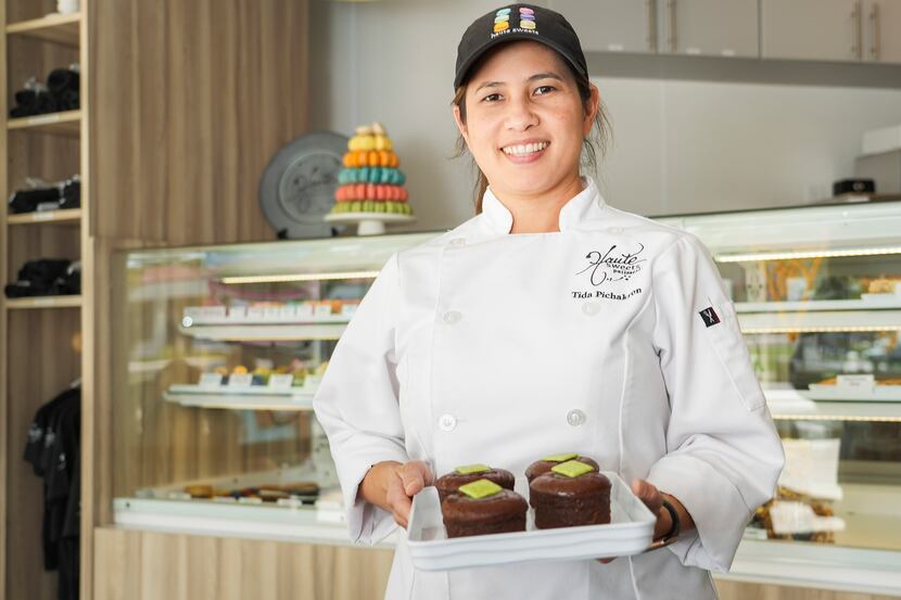 Chef Tida Pichakron with a tray of molten chocolate cake at Haute Sweets Patisserie in...