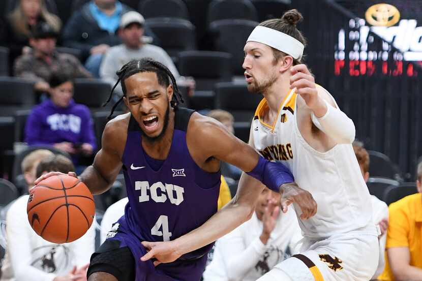 LAS VEGAS, NEVADA - NOVEMBER 26:  PJ Fuller #4 of the TCU Horned Frogs drives against Jake...