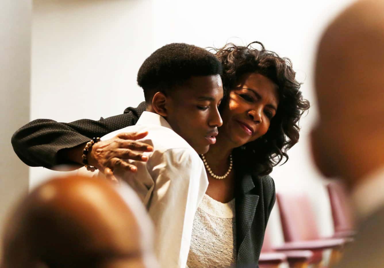 Dallas County District Attorney Faith Johnson hugs Kevon Edwards after former officer Roy...