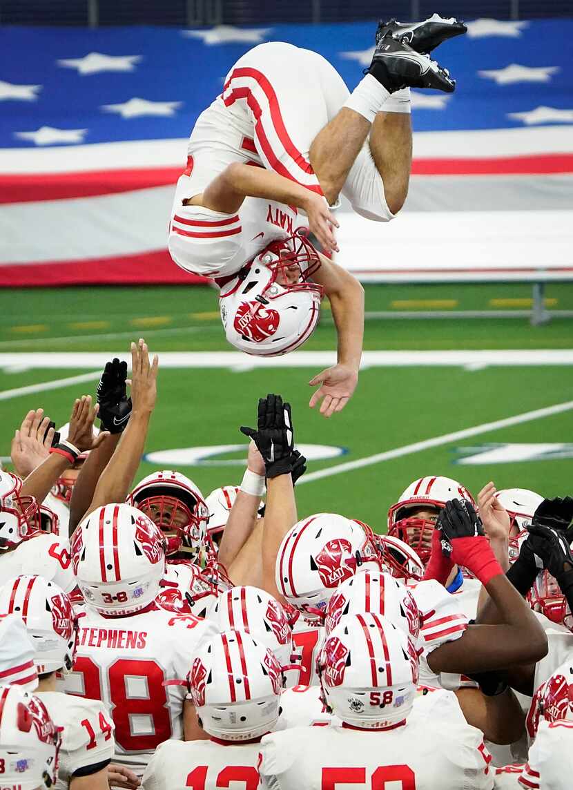 Katy defensive back Colton Cable flipped over his teammates as the team took the field Jan....