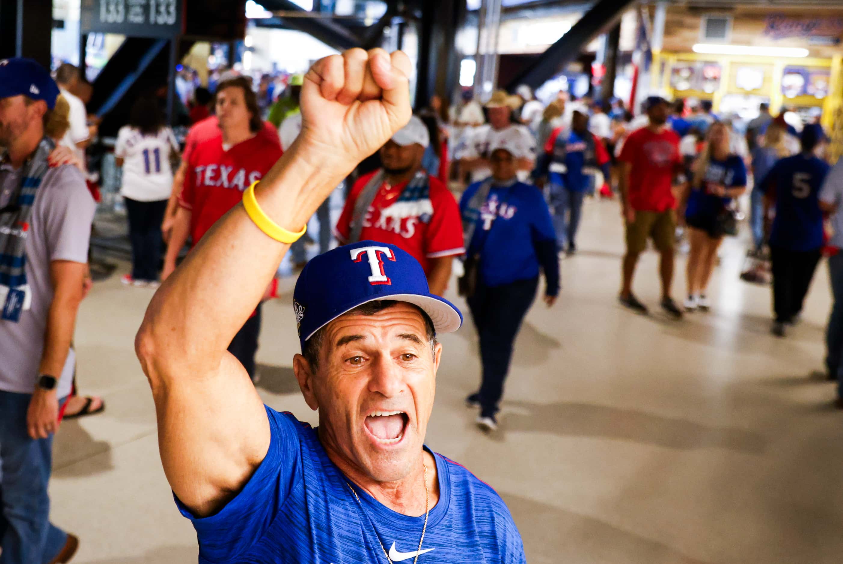 Texas Rangers fan Jim Giattini of Fort Worth, chants saying “Lets Go Rangers” ahead of Game...