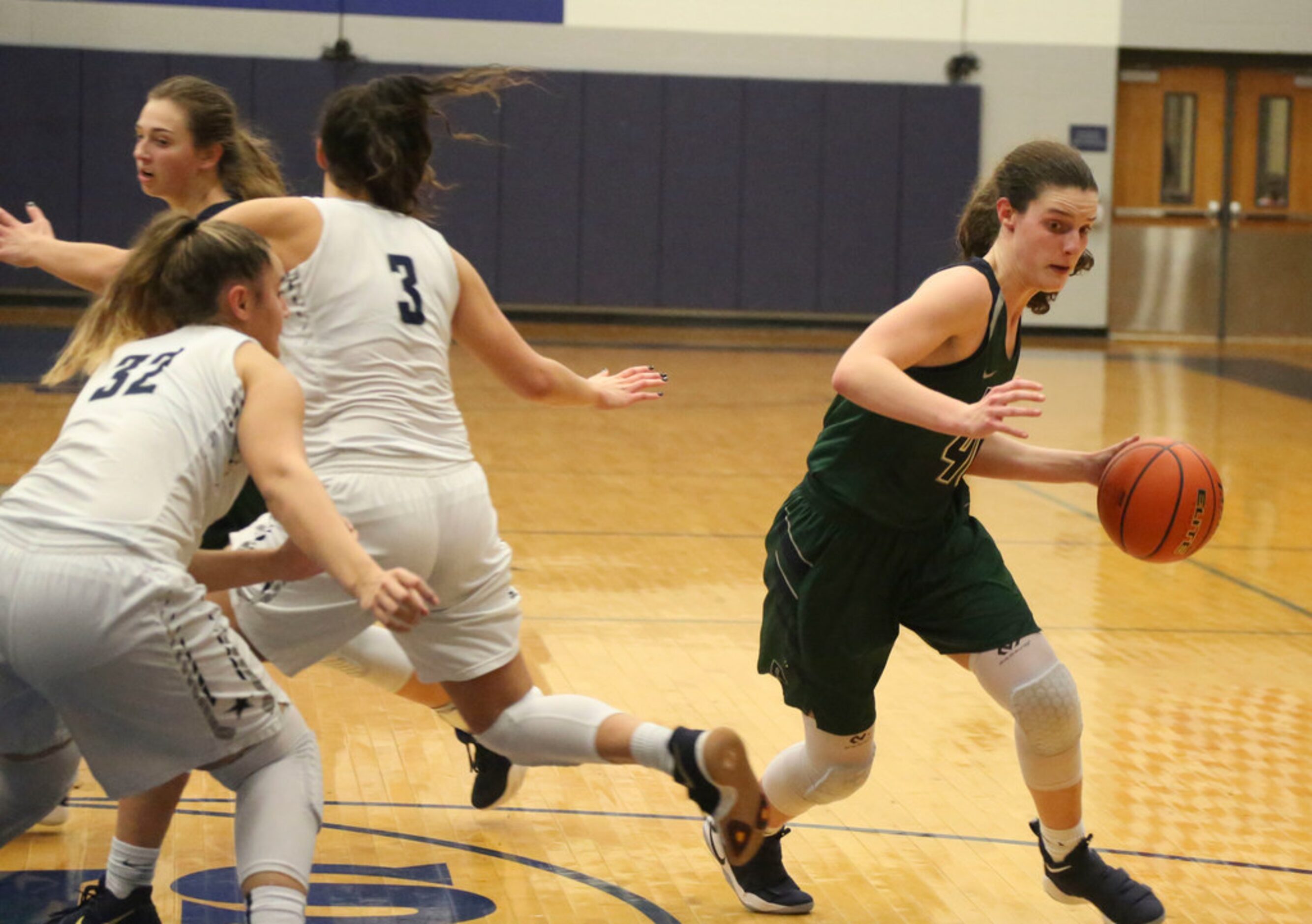 Frisco Reedy's Mary Rose Foster (40), right, gets past  at Frisco Lone Star High players...