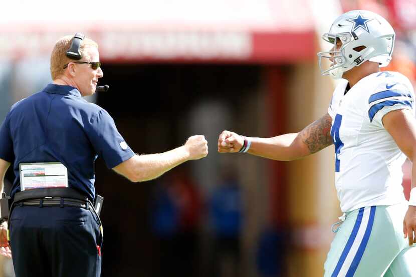 Dallas Cowboys head coach Jason Garrett and quarterback Dak Prescott (4) after Prescott...