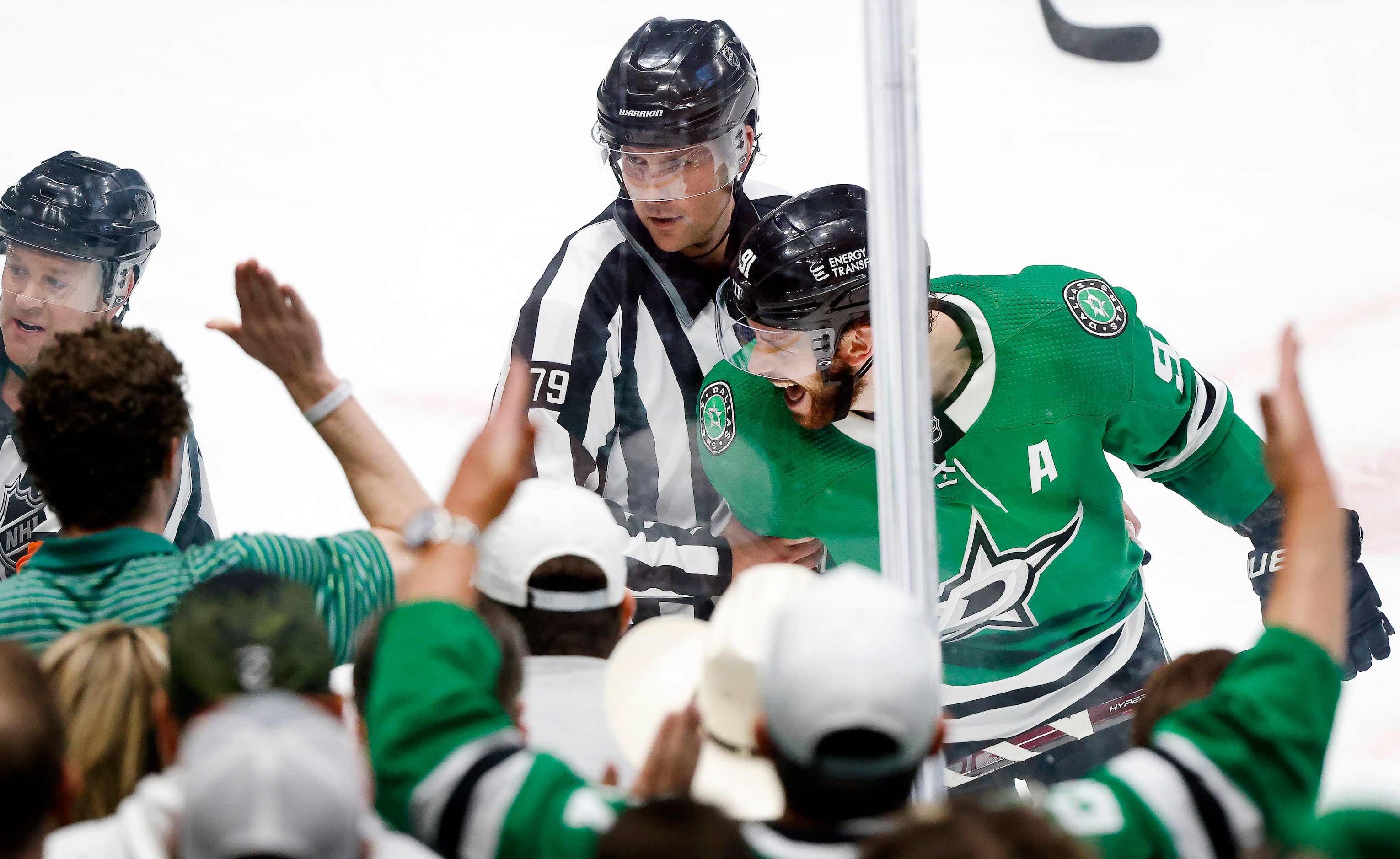 Dallas Stars center Tyler Seguin (91) eyes Seattle Kraken center Yanni Gourde (not pictured)...