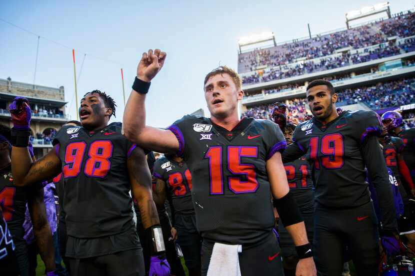 TCU Horned Frogs quarterback Max Duggan (15, center) and other players celebrate after a...