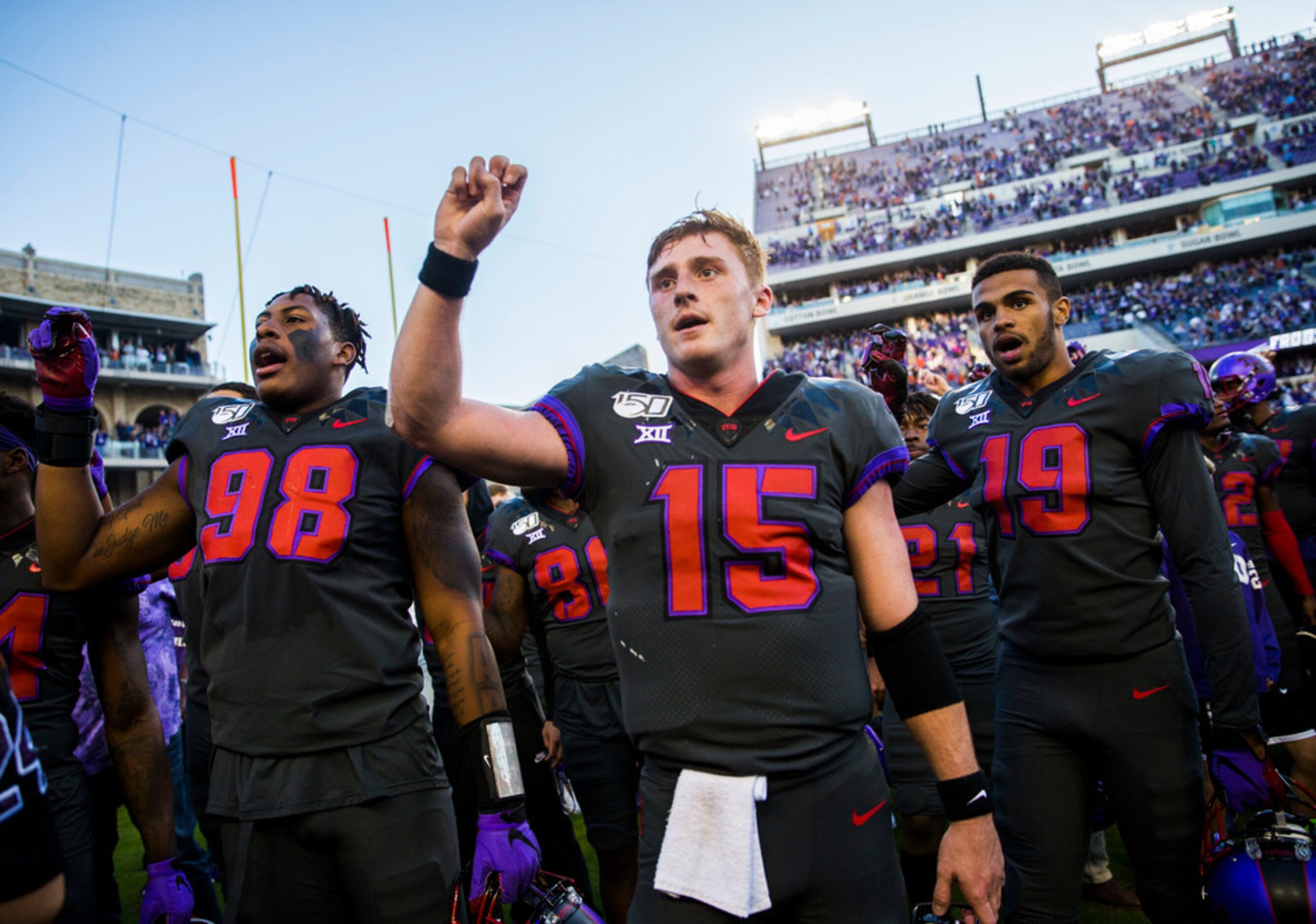 TCU Horned Frogs quarterback Max Duggan (15, center) and other players celebrate after a...