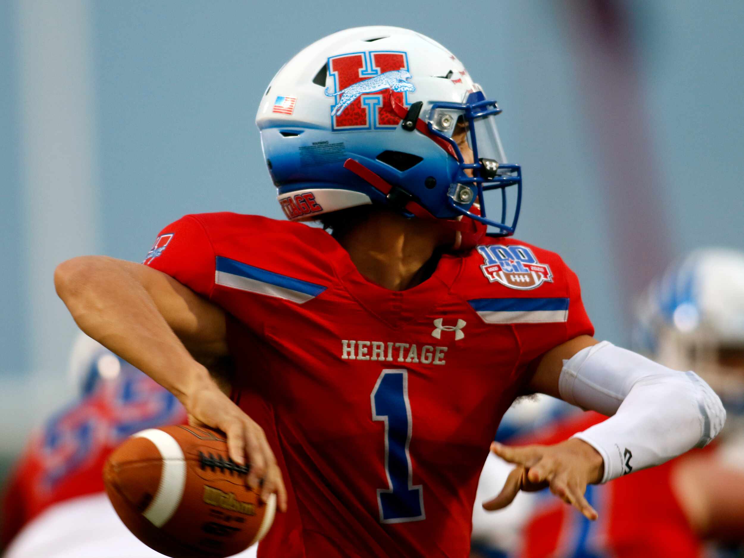 Midlothian Heritage quarterback Daelin Rader (1) looks to pass during the first quarter of...
