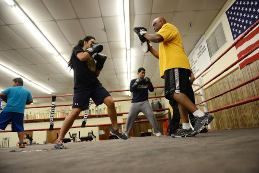 Patricia Serrano, 16, spars with volunteer coach Daryl Thomas.