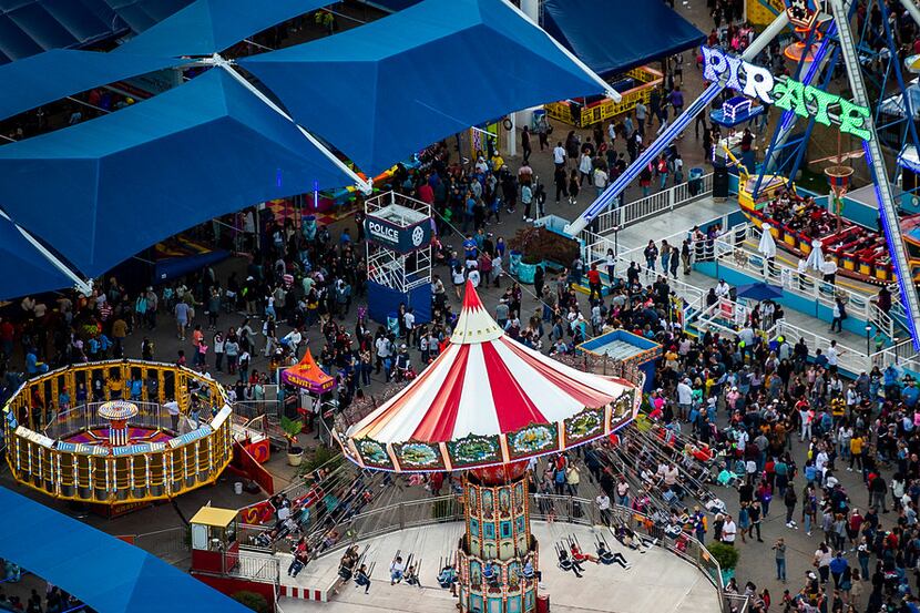 Crowds fill the midway at the State Fair of Texas in Fair Park on Saturday, Oct. 20, 2018,...