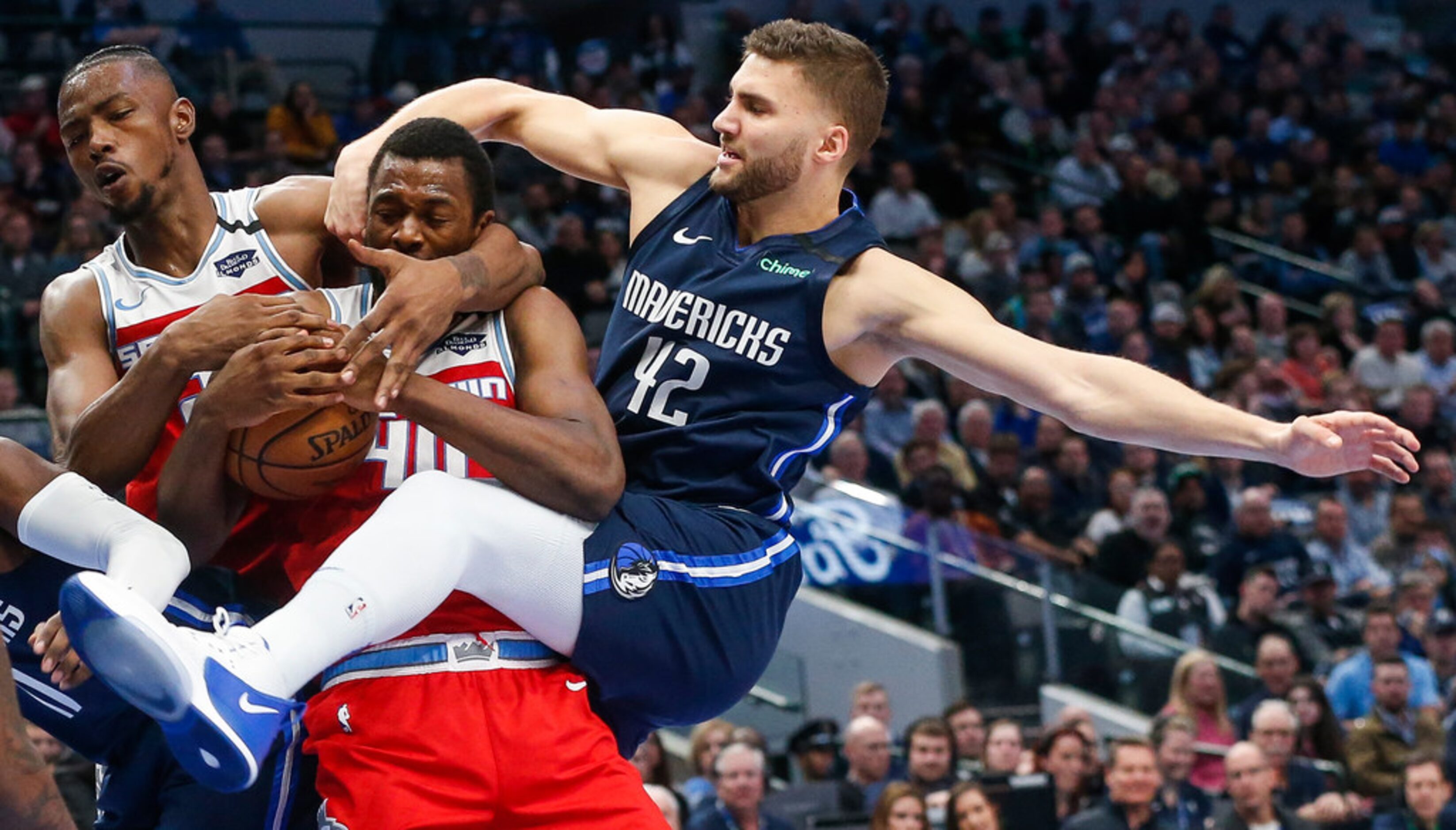 (from left) Sacramento Kings forward Harry Giles III (20), forward Harrison Barnes (40), and...