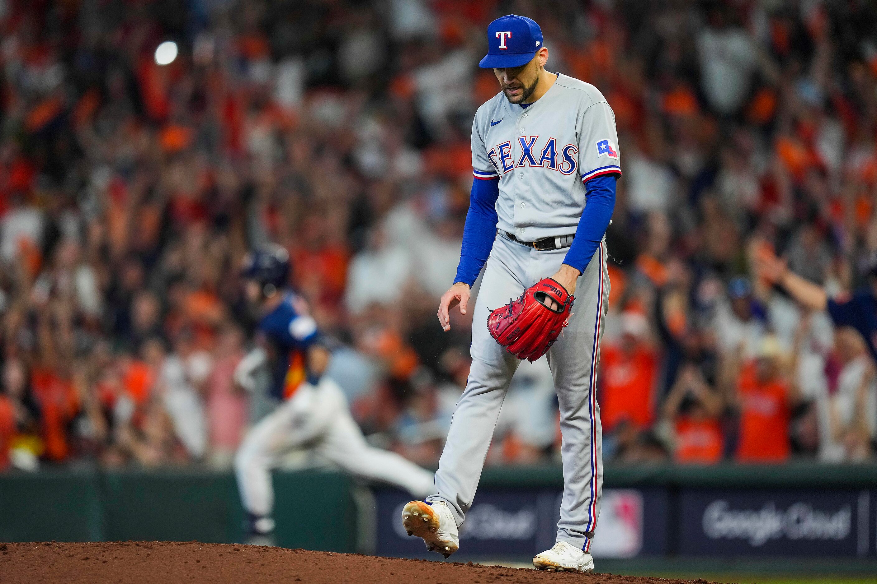 Texas Rangers starting pitcher Nathan Eovaldi reacts as Houston Astros third baseman Alex...