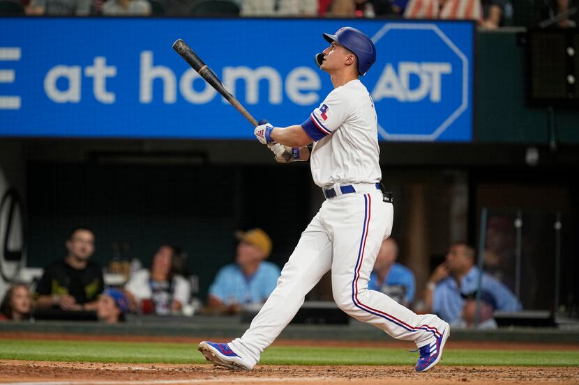 Texas Rangers' Corey Seager hits a double in the ninth inning of a