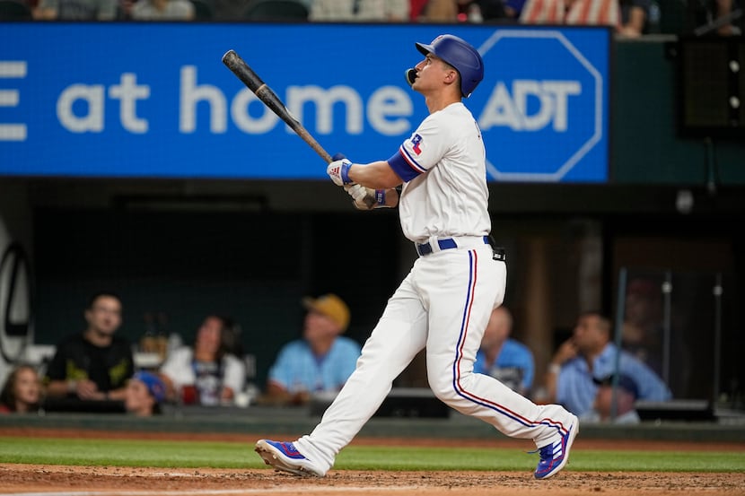 Texas Rangers' Corey Seager watches his solo home against the Los Angeles Angels during the...