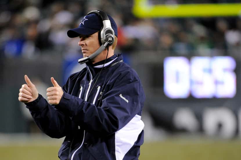 Dallas Cowboys interim head coach Jason Garrett reacts after a touchdown by tight end Jason...