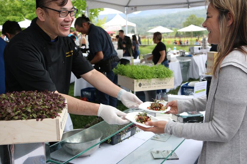 Michael Wong, chef of Mark Hopkins restaurant at the InterContinental in Napa Valley, serves...
