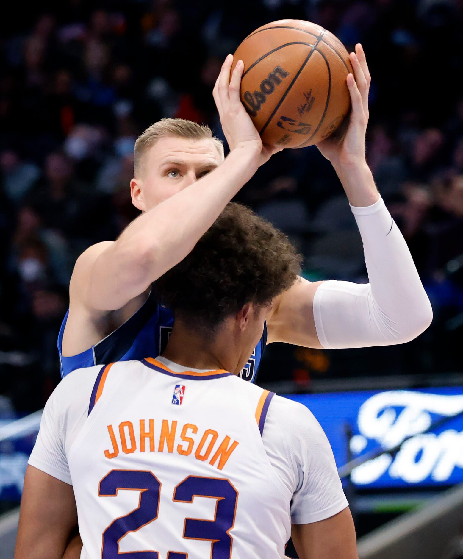 Dallas Mavericks center Kristaps Porzingis (6) catches a pass before taking a shot over...