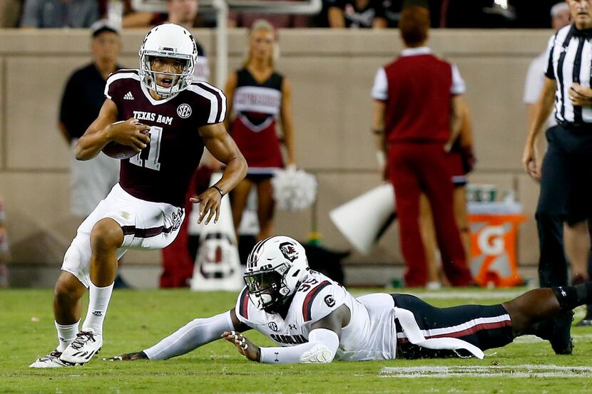COLLEGE STATION, TX - SEPTEMBER 30:  Kellen Mond #11 of the Texas A&M Aggies avoids the...