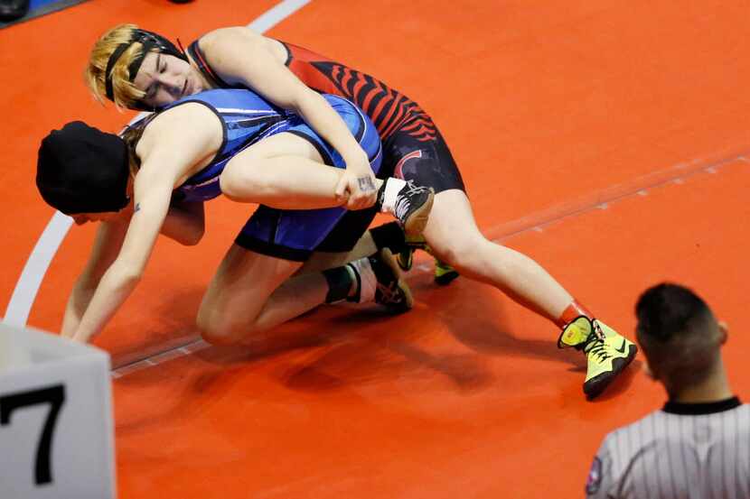 Euless Trinity's Mack Beggs wrestles Grand Prairie's Kailyn Clay in the 6A girls 110 weight...