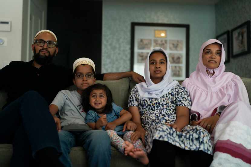 The Zakir family, from left, father Yusuf, son Burhanuddin, Yusuf's niece, Insiya Maimoon;...