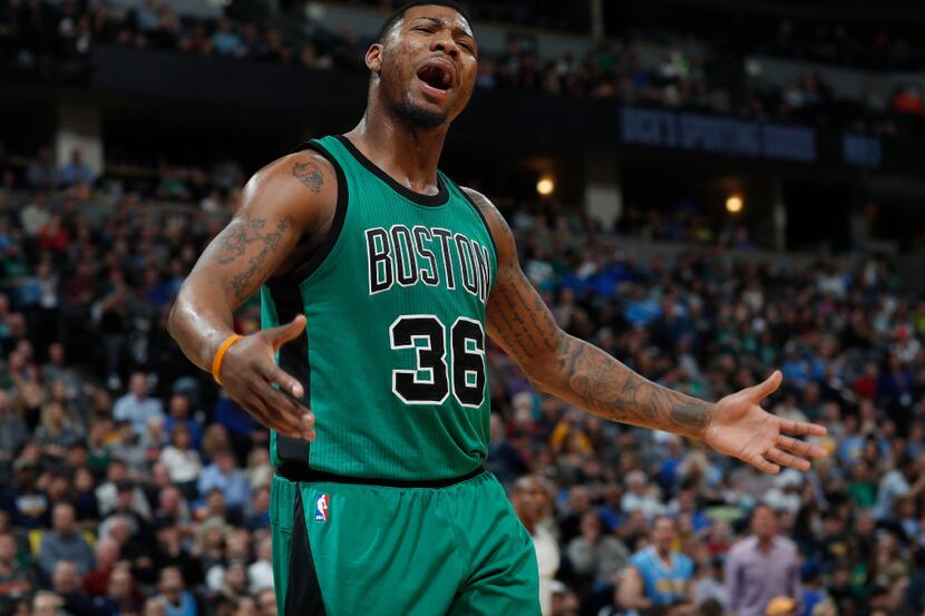 Boston Celtics guard Marcus Smart argues for a call against the Denver Nuggets in the second...