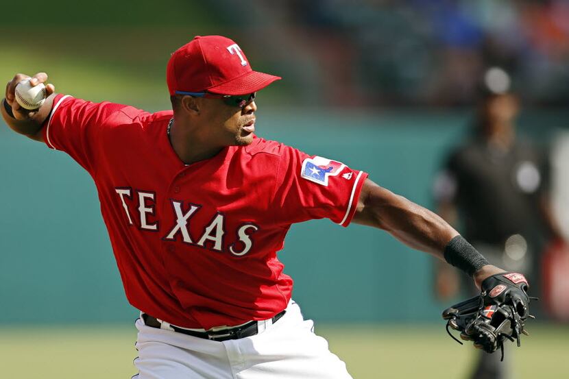 Texas Rangers third baseman Adrian Beltre throws Houston Astros right fielder George...