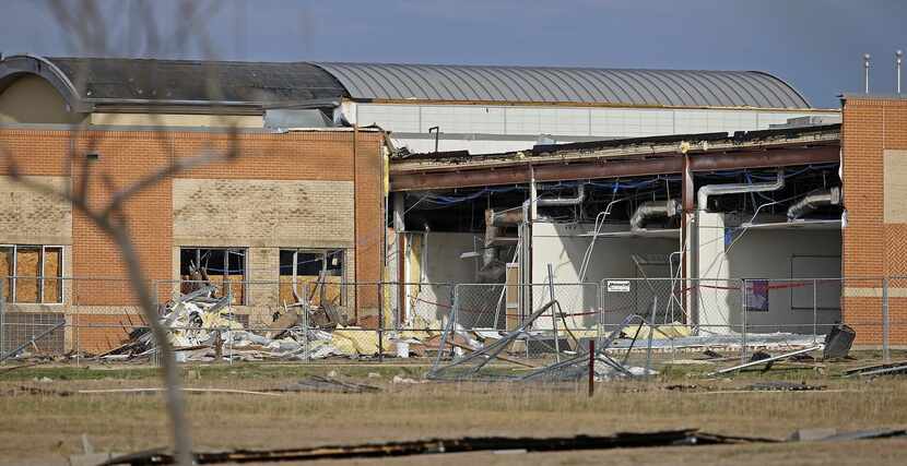 
Storm damages of Donald T. Shields Elementary School are seen from Lake Ridge Drive in Red...
