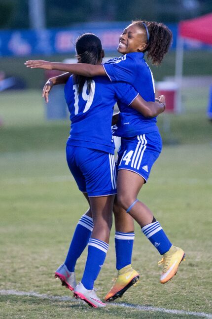 Solar Chelsea Red forward Trinity Byars (left) and Raigen Powell celebrate after Byars...