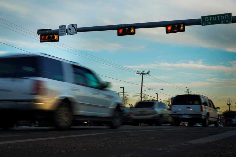 Cars run a red light at  South Buckner Boulevard and Bruton Road on Feb. 7 in Dallas....