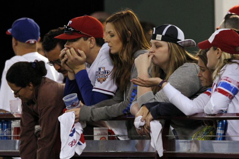 Texas Rangers' fans grew dejected as the Baltimore Orioles piled up runs Friday night in...