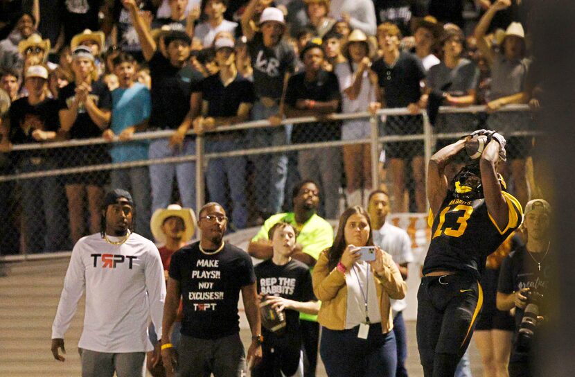 Forney's Imari Jehiel (13) catches a pass to score against Longview during the first half of...