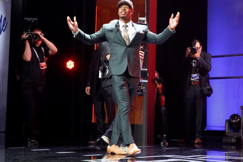 Baylors Corey Coleman walks on the stage poses after being selected by the Cleveland Browns...