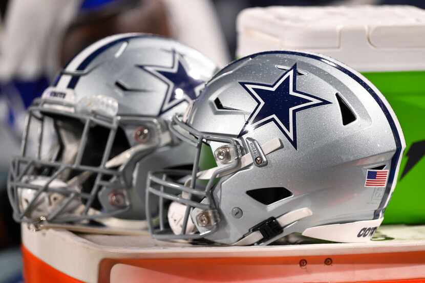 Dallas Cowboys helmets shown during the second half of an NFL football game against the...