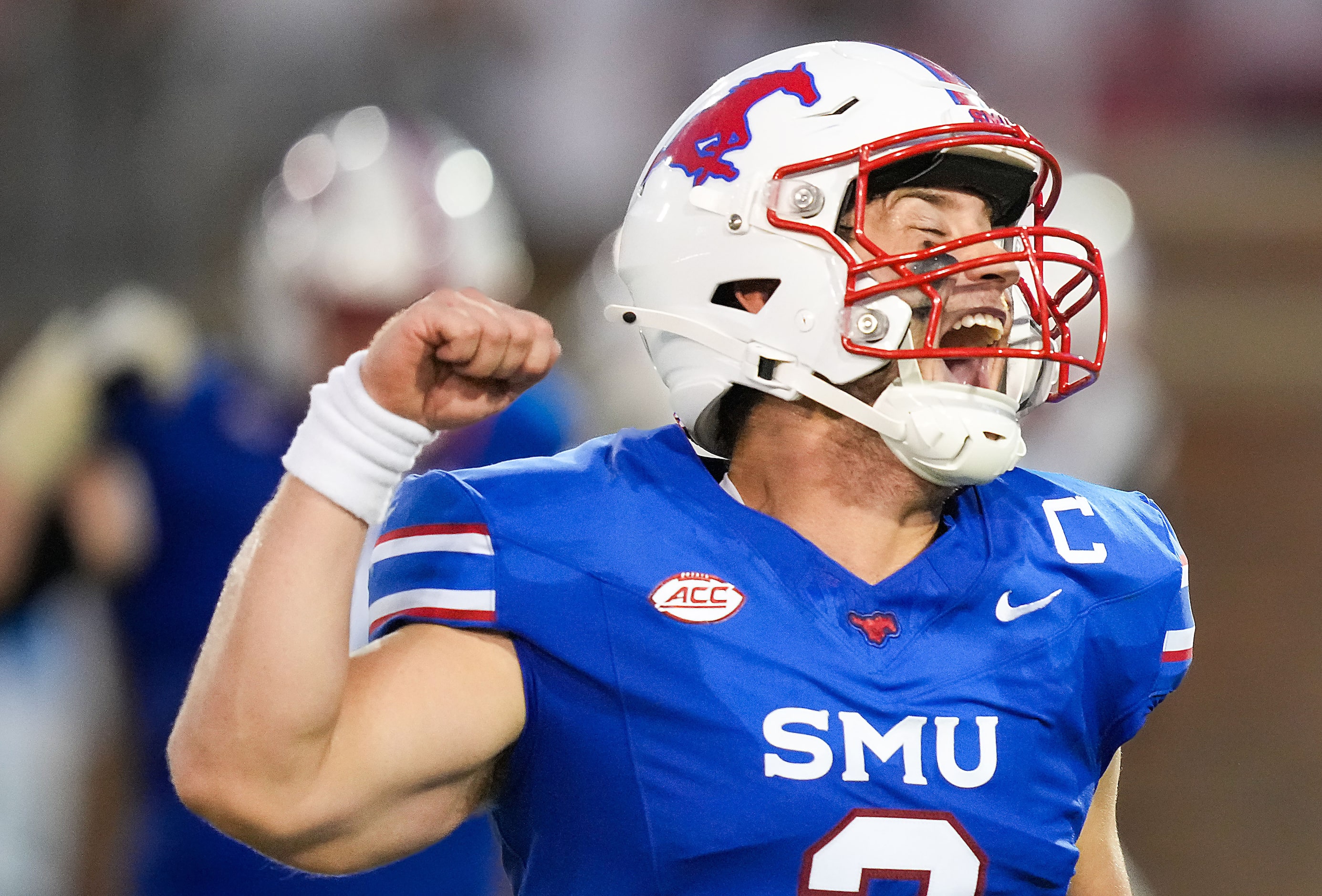 SMU quarterback Preston Stone celebrates after throwing a touchdown pass to wide receiver...