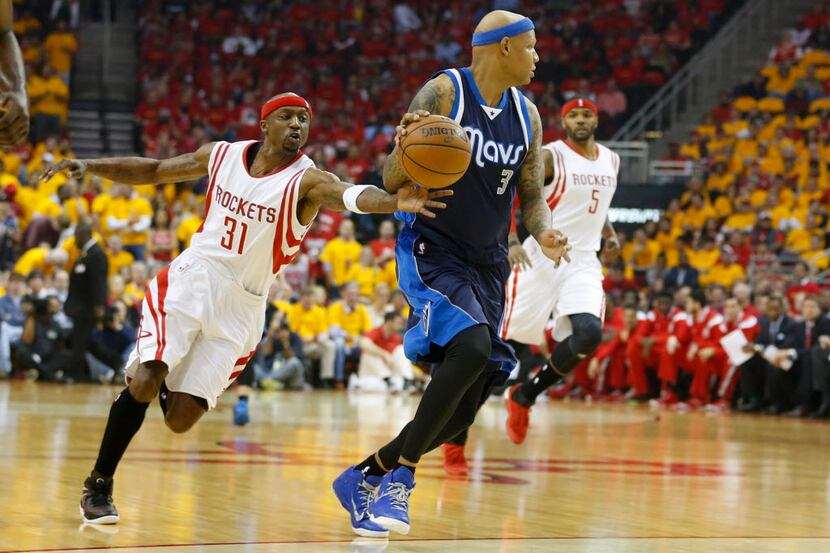 Houston Rockets guard Jason Terry (31) attempts to steal the ball from Dallas Mavericks...
