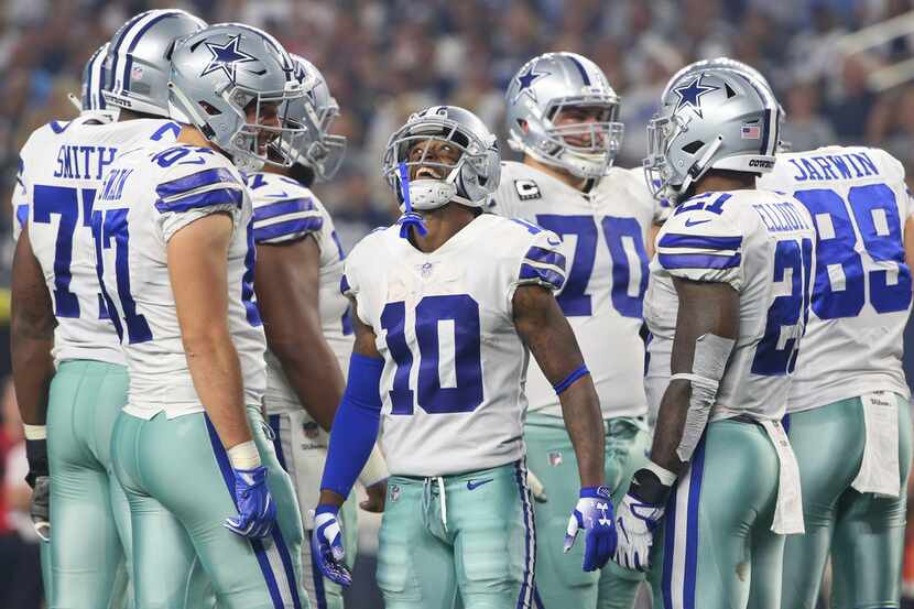 Dallas Cowboys wide receiver Tavon Austin (10) jokes around during a brief break in action...