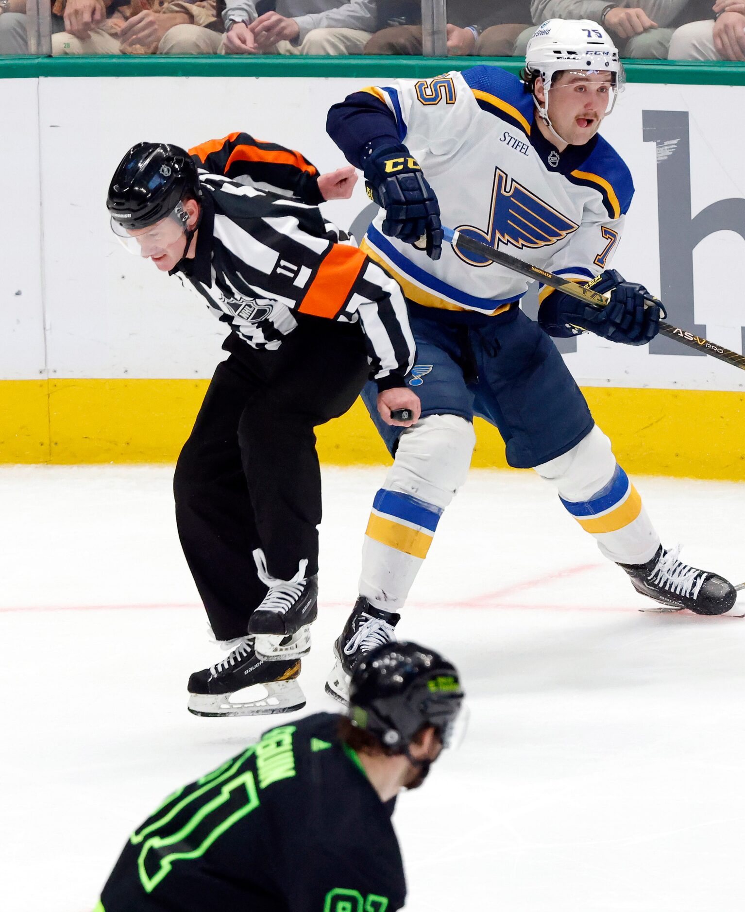 Referee Kelly Sutherland (11) jumps out of the way as the play came his way during the third...