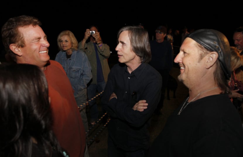 Kelcy Warren (left), CEO of Energy Transfer Partners, talked with musicians Jackson Browne...