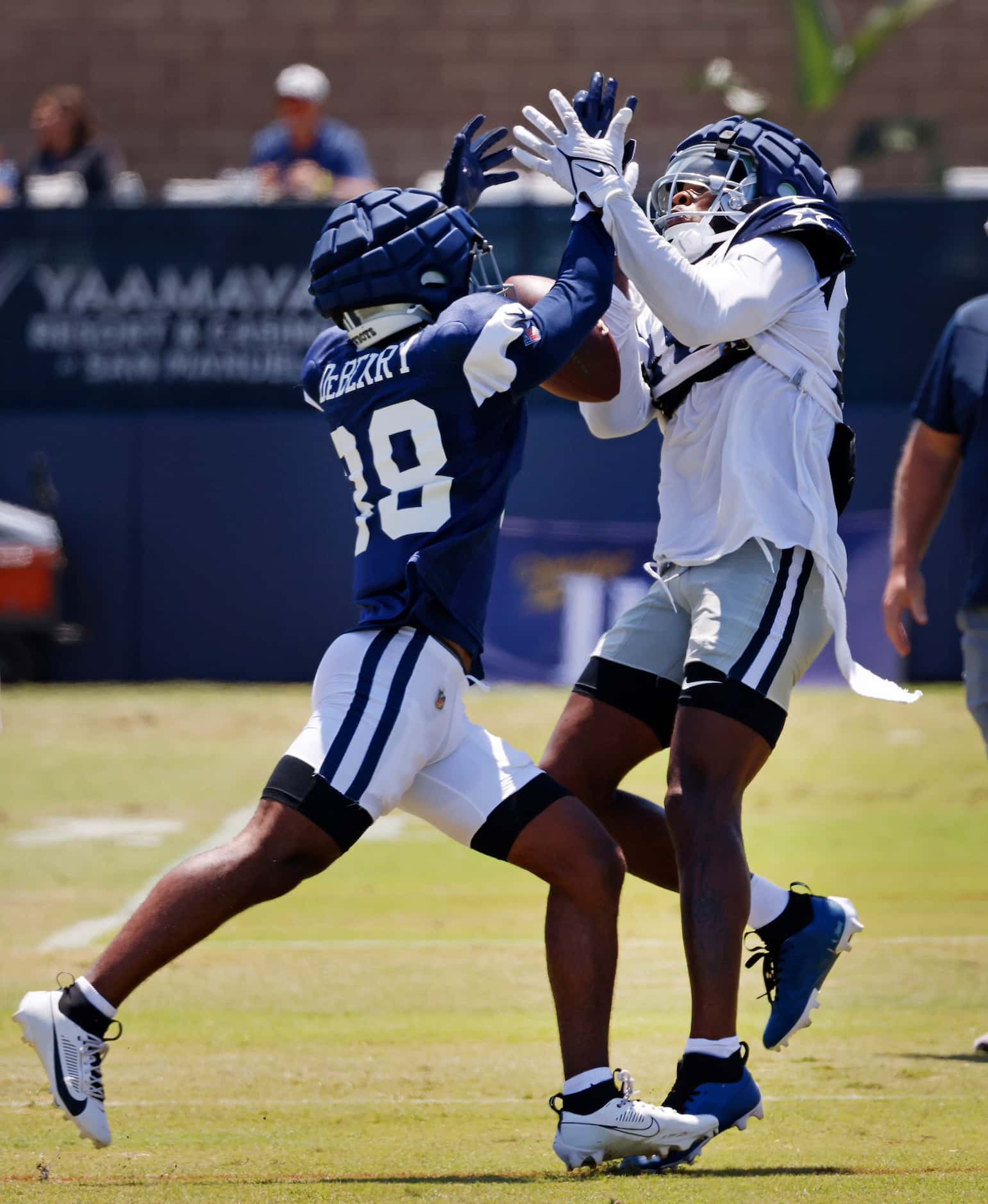 A long pass slides between Dallas Cowboys wide receiver Racey McMath (80) and defender Josh...