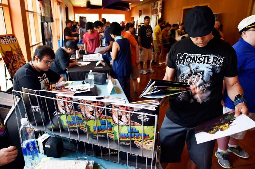 Patrick Ponce, 49, of Amarillo, browsed through comics during the Texas Latino Comic Con at...