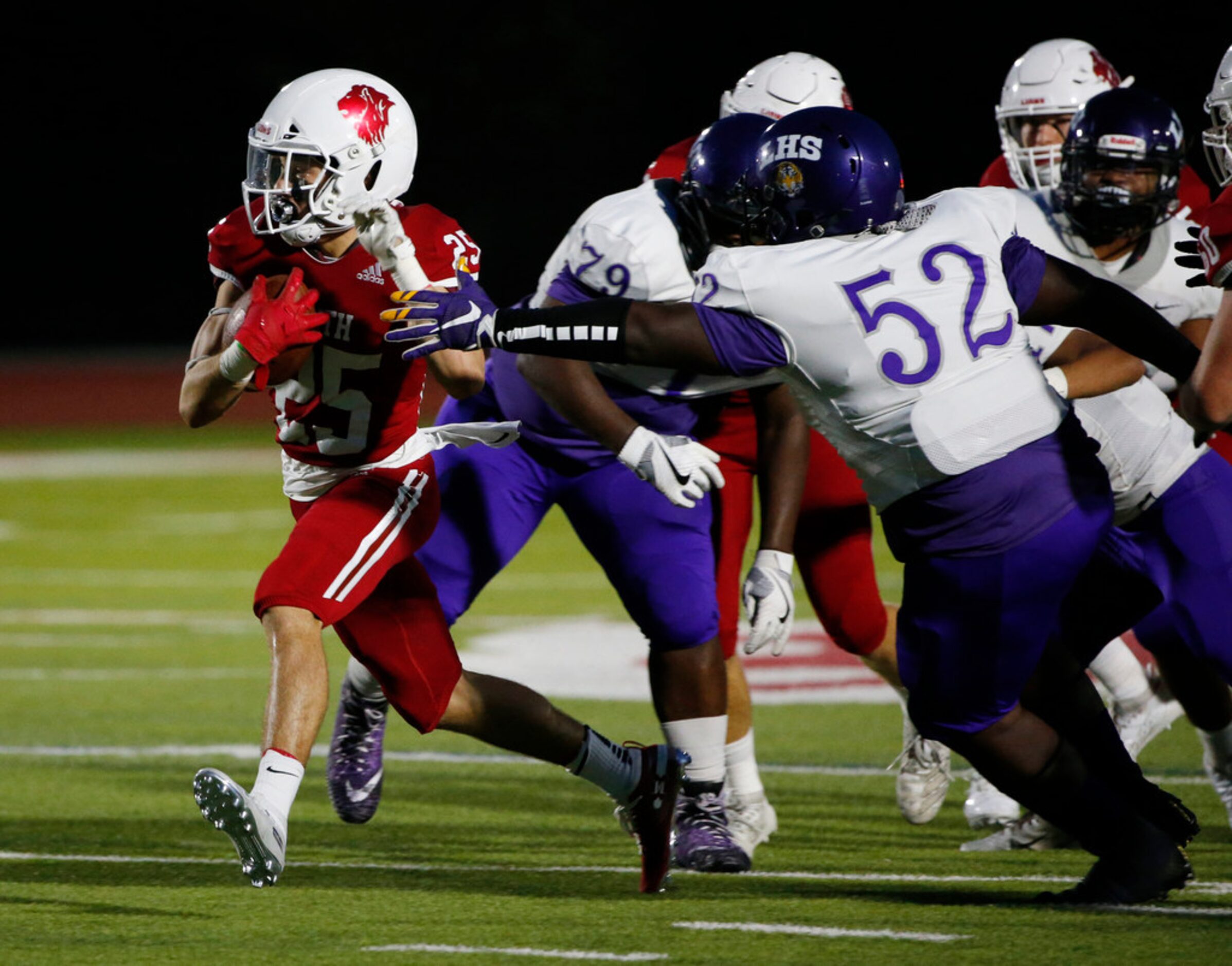 Grapevine Faith Christian's Mark Saunders (25) breaks away from Lincoln's Antoine Price (52)...