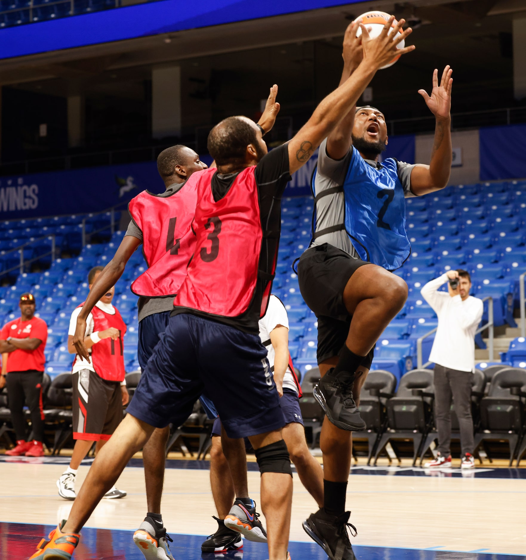 Marcus Billard (2) from Team Arike goes up for the shot against Team Marina’s Brian Bouyer...