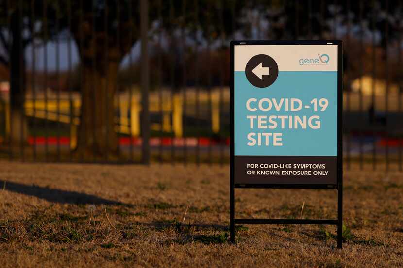 Signage directs people to a COVID-19 testing location at Dallas College Mountain View campus...