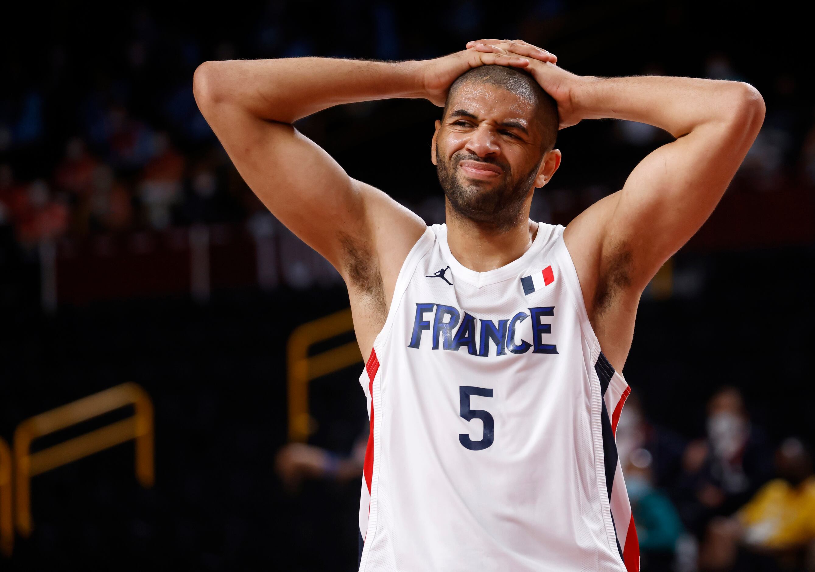 France’s Nicols Batum (5) reacts to a teammate getting called for a foul in a game against...
