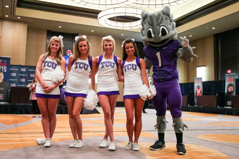 Jul 22, 2013; Dallas, TX, USA; TCU Horned Frogs cheerleaders and mascot pose for a photo...